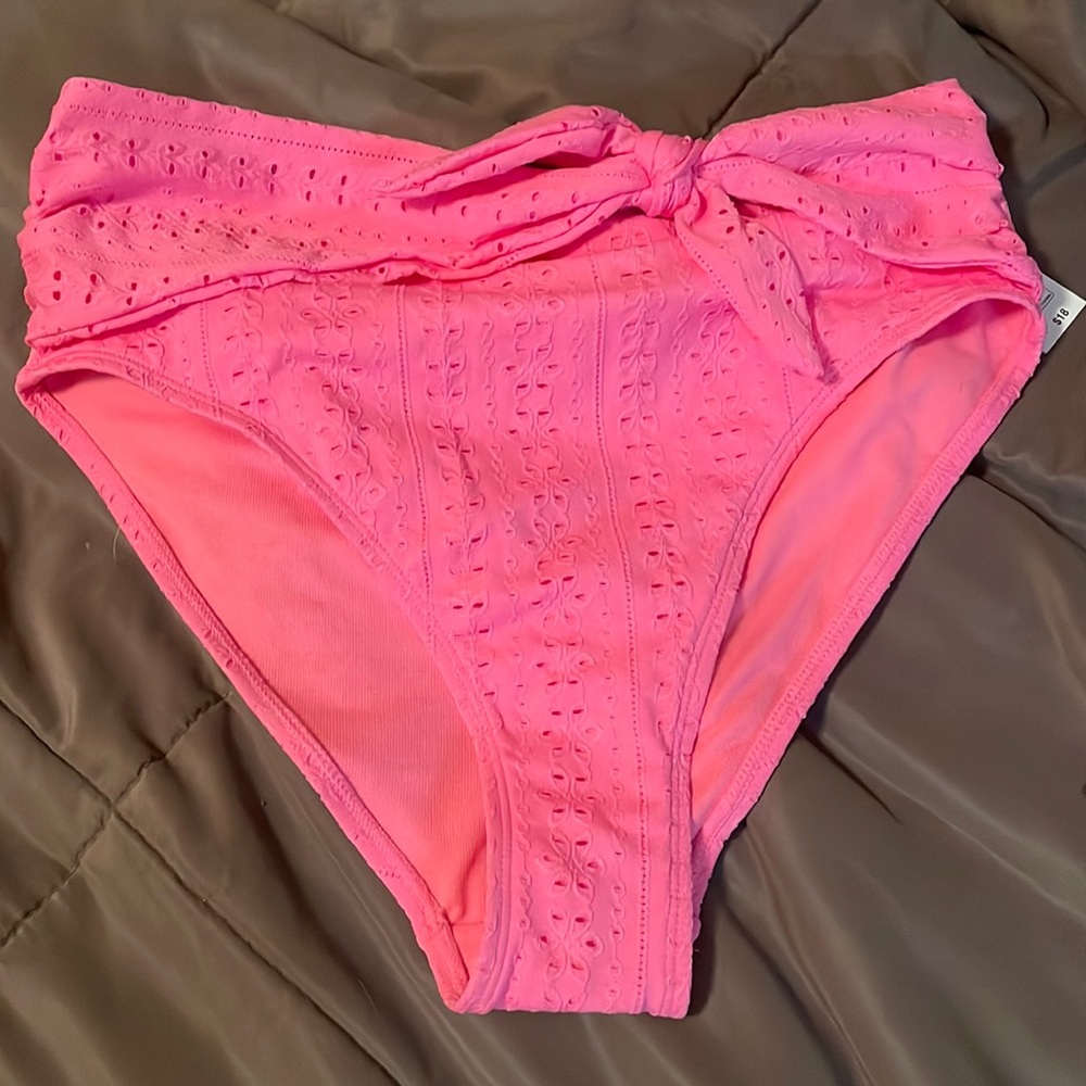 Celebrity pink, swim bottoms, side tie eyelet design. Size women’s large 11-13.